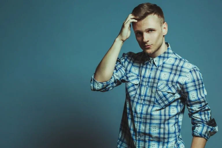 Casual young man blue plaid shirt