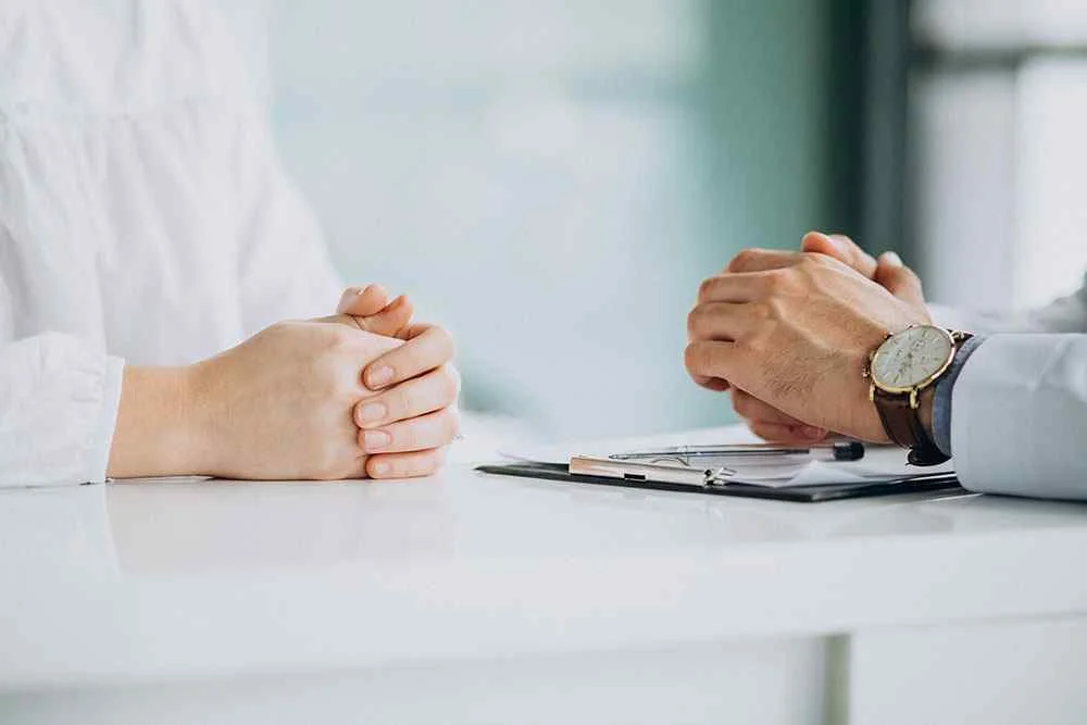 Close-up of patient and doctor hands during consultation