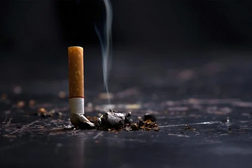 Extinguished cigarette with smoke